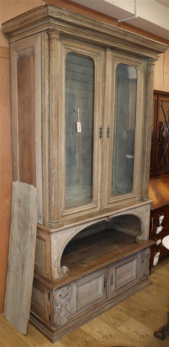 A late 19th century French limed oak glazed bookcase W.118cm